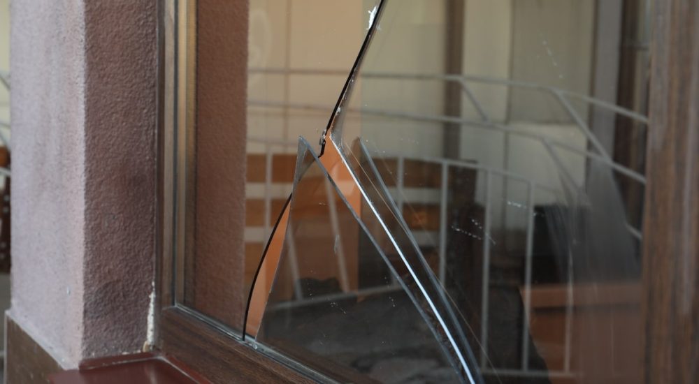 a broken window–property damage